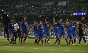 Juventus players celebrate at the end of the Champions League second leg semifinal soccer match between Real Madrid and Juventus, at the Santiago Bernabeu stadium in Madrid, Wednesday, May 13, 2015. The match ended in a 1-1 draw and Juventus advances to the final on a 3-2 aggregate. (AP Photo/Andres Kudacki)
